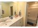 Bathroom with double vanity, white cabinets, and a bathtub at 136 Timber Oaks Dr., Myrtle Beach, SC 29588