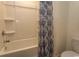 Clean bathroom with a shower/tub combo and patterned shower curtain at 136 Timber Oaks Dr., Myrtle Beach, SC 29588