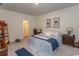 Spacious bedroom with large bed, ensuite bathroom access, and ample natural light at 136 Timber Oaks Dr., Myrtle Beach, SC 29588