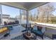 Screened porch with backyard view, wicker furniture, and grill at 136 Timber Oaks Dr., Myrtle Beach, SC 29588