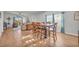 Bright dining area with table and chairs, hardwood floors, and access to living room at 144 Rutland Ct., Conway, SC 29526