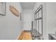 Inviting entryway with coat rack, bench, and decorative wall art at 144 Rutland Ct., Conway, SC 29526