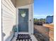 Inviting front door entrance with welcome mat and landscaping at 144 Rutland Ct., Conway, SC 29526