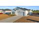 Charming house exterior with driveway and landscaping at 144 Rutland Ct., Conway, SC 29526
