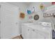 Laundry room with washer, dryer, and shelving at 144 Rutland Ct., Conway, SC 29526