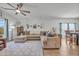 Open living room with L-shaped sofa and access to the dining area at 144 Rutland Ct., Conway, SC 29526
