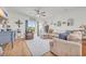 Spacious living room with L-shaped sectional sofa and hardwood floors at 144 Rutland Ct., Conway, SC 29526