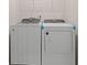 Bright laundry room, complete with washer and dryer at 144 Vineyard Place # 144, Pawleys Island, SC 29585