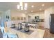 Spacious dining area with a chandelier and view into the kitchen at 1455 Porchfield Dr., Conway, SC 29526