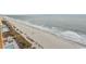 Aerial view of beach, ocean, and nearby buildings at 1501 S Ocean Blvd. # 1542, Myrtle Beach, SC 29577