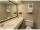 Clean condo bathroom with sink, toilet, and plenty of towels at 1501 S Ocean Blvd. # 1542, Myrtle Beach, SC 29577
