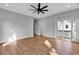 Light-filled bedroom featuring hardwood floors and access to a private balcony at 16 Comfort Ln., Pawleys Island, SC 29585