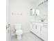 Bright bathroom featuring white cabinets, a large mirror, tile flooring, and a white toilet at 160 Stonegate Blvd. # 160, Murrells Inlet, SC 29576