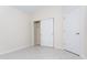 Bright bedroom with neutral walls, closet, and a window with cellular shades, and tile flooring at 160 Stonegate Blvd. # 160, Murrells Inlet, SC 29576