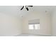 Bright bedroom featuring neutral walls, ceiling fan, vaulted ceiling, and a window with a cellular shade at 160 Stonegate Blvd. # 160, Murrells Inlet, SC 29576