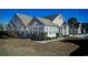 Attractive home with a sunroom, stone accents, manicured landscaping, and a palm tree at 160 Stonegate Blvd. # 160, Murrells Inlet, SC 29576