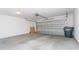 Spacious garage with a gray door, concrete floors, and room for vehicles and storage at 160 Stonegate Blvd. # 160, Murrells Inlet, SC 29576