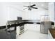 Contemporary kitchen featuring white cabinets, dark countertops, and stainless appliances at 160 Stonegate Blvd. # 160, Murrells Inlet, SC 29576