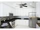 Updated kitchen with white cabinets, granite counters, and stainless steel appliances at 160 Stonegate Blvd. # 160, Murrells Inlet, SC 29576