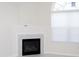 Living room showcases a fireplace with tile surround and an arched window with blinds at 160 Stonegate Blvd. # 160, Murrells Inlet, SC 29576