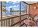 Enjoy serene lake views from this screened porch with seating at 180 Rothbury Circle # 117, Myrtle Beach, SC 29572