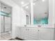 Bathroom featuring double vanity, modern fixtures, and walk-in shower at 2022 N Waccamaw Dr., Garden City Beach, SC 29576