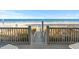 Ocean view from a deck with stairs leading to the beach; a serene coastal experience at 2022 N Waccamaw Dr., Garden City Beach, SC 29576