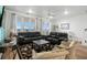 Bright living room featuring comfortable seating, large windows with ocean views, and a decorative rug at 2022 N Waccamaw Dr., Garden City Beach, SC 29576