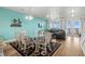 Living and dining area with beach views, stylish furnishings, and access to a relaxing deck at 2022 N Waccamaw Dr., Garden City Beach, SC 29576