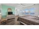 Inviting main bedroom with ocean view, wicker dresser, and ceiling fan at 2022 N Waccamaw Dr., Garden City Beach, SC 29576