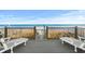 Deck overlooking the beach with chairs at 2022 N Waccamaw Dr., Garden City Beach, SC 29576