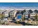 Aerial view shows private pool shared by beach houses, with lounge chairs and easy beach access at 2022 N Waccamaw Dr., Garden City Beach, SC 29576