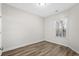 Simple bedroom with hardwood floors and window at 209 Wando River Rd. # 10C, Myrtle Beach, SC 29579