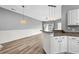 Open concept dining area with hardwood floors and kitchen views at 209 Wando River Rd. # 10C, Myrtle Beach, SC 29579