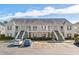 Two-story building with multiple units and ample parking at 209 Wando River Rd. # 10C, Myrtle Beach, SC 29579