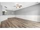 Spacious living room with hardwood floors and ceiling fan at 209 Wando River Rd. # 10C, Myrtle Beach, SC 29579