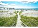Wooden steps lead to a sandy beach path at 2225 Essex Dr. # F, Surfside Beach, SC 29575