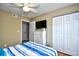 Bedroom with a dresser, TV and large closet at 2225 Essex Dr. # F, Surfside Beach, SC 29575