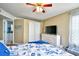 Bedroom with white dresser, ceiling fan and nautical bedding at 2225 Essex Dr. # F, Surfside Beach, SC 29575