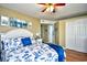 Spacious bedroom with nautical bedding and double doors to the bathroom at 2225 Essex Dr. # F, Surfside Beach, SC 29575