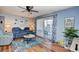Living room with hardwood floors and balcony access at 2225 Essex Dr. # F, Surfside Beach, SC 29575