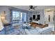 Living room with hardwood floors and balcony access at 2225 Essex Dr. # F, Surfside Beach, SC 29575