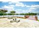 Community patio with tables and chairs near pond at 2225 Essex Dr. # F, Surfside Beach, SC 29575