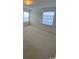 Bright bedroom with carpet and two windows at 2276 Essex Dr. # K, Surfside Beach, SC 29575