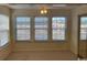 Sunroom with three windows and a mirrored closet at 2276 Essex Dr. # K, Surfside Beach, SC 29575