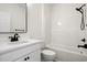 Bathroom with modern black fixtures, sleek vanity, and shower-tub combo at 2428 Park St., North Myrtle Beach, SC 29582
