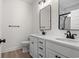 Modern bathroom features double vanity, sleek fixtures, and large mirrors at 2428 Park St., North Myrtle Beach, SC 29582