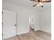 A bedroom includes a bathroom door and a five-panel door. The room also features wood-look floors at 2428 Park St., North Myrtle Beach, SC 29582