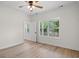 Bright bedroom featuring wood floors, large windows, and a private ensuite bathroom at 2428 Park St., North Myrtle Beach, SC 29582