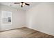 Well-lit bedroom with a ceiling fan and wood-look flooring at 2428 Park St., North Myrtle Beach, SC 29582